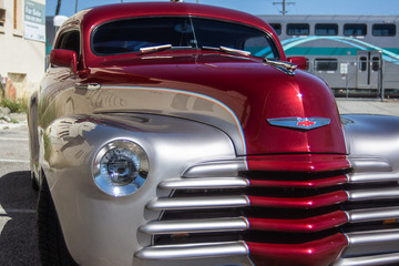 restored vintage auto in red and grey
