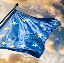 EU flag waving against sunset sky
