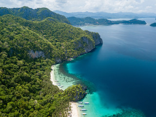 Aerial drone view of the scenic 7 Commando and Papaya beaches in El Nido, Palawan
