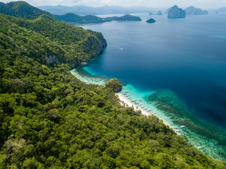 Fototapeta na wymiar Aerial drone view of the scenic 7 Commando and Papaya beaches in El Nido, Palawan