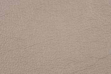 A close up of a white leather texture