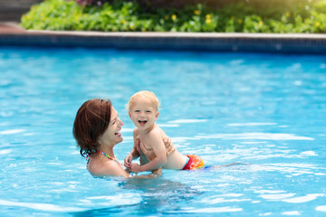 Mother and baby in swimming pool