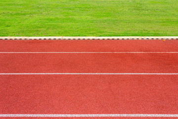 White lines of stadium and texture of running racetrack red rubber racetracks in outdoor stadium...