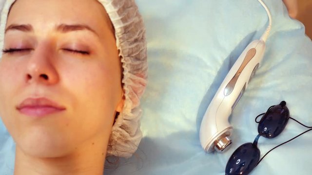 Skin Rejuvenation Treatment, Woman facial rejuvenation salon receive skin treatment.