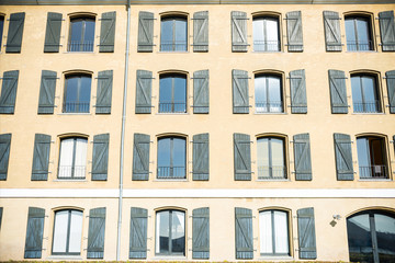full frame view of beautiful house with windows and open wooden shutters in copenhagen, denmark