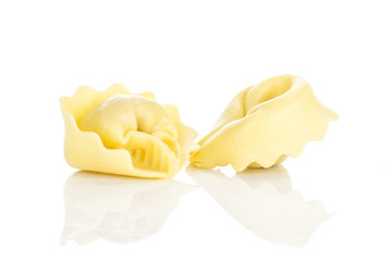 Two raw tortellini Italian traditional pasta isolated on white background.