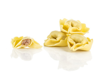 Raw tortellini Italian pasta stuffed with meat isolated on white background traditional dumpling.