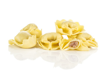 Tortellini Italian raw pasta stuffed with meat isolated on white background traditional dumpling.