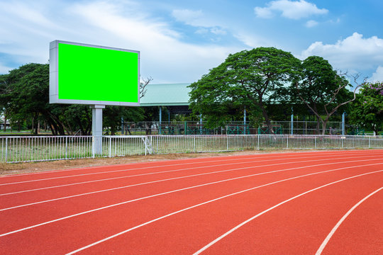 Digital Blank Scoreboard At Football Stadium With Running Track In Sport Stadium In Outdoor ,Advertising Billboard LED, Empty Green Screen Digital.