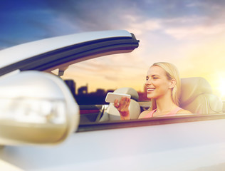 road trip, technology and communication concept - happy young woman calling on smartphone or using...