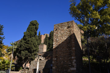 Fototapeta na wymiar The Alcazaba is a palatial fortification in Malaga, Spain. It was built by the Moorish Hammudid dynasty in the early 11th century. 