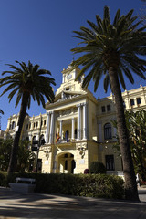 Fototapeta na wymiar The Stunning architecture of the City Hall in Malaga shines in the Spanish Sun 