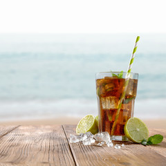 glass of summer drink with ice and lemon. 