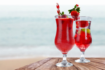 Summer time and glasses of drink on wooden table. 
