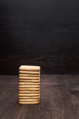 Shortbread cookie on a wooden table. Tower of cookies. Wooden background