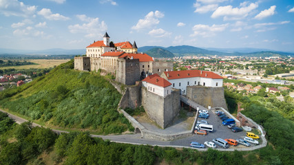 Aerial view on the ancient castle of Palanok and the foothills of Carpathians Mountains, in Mukachevo, the Transcarpathian region of Ukraine.