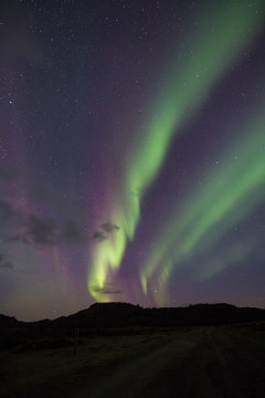 Northern Lights - Aurora borealis. Beautiful picture of massive multicoloured green vibrant Aurora Borealis in the night sky