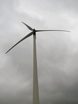 wind turbine in fog  windmill wind energy