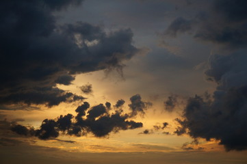 Fototapeta na wymiar Dark clouds at sunset sky