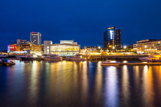 View of the marina and port in Bodo at night. Norway. Skyline of city.