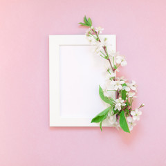 Blank frame mockup with white flowers