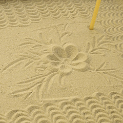 Sand from candlestick with ornament in the form of flowers, background, texture.
