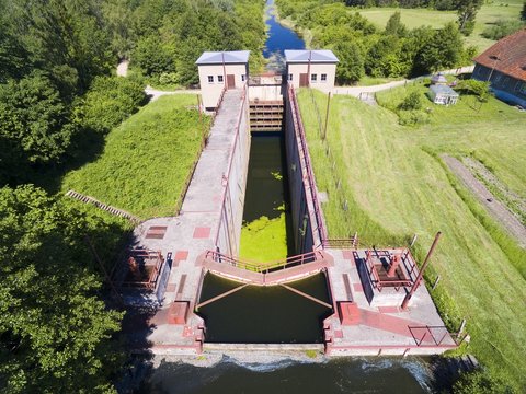 Giant concrete lock Piaski (Sandhof) in Guja - part of Masurian Canal which was to connect the Great Masurian Lakes with Baltic sea, Mazury, Poland (former East Prussia). Rydzowka Lake in background
