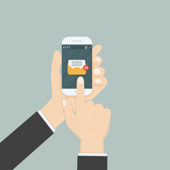 Hand holding smartphone and touching screen with text messaging.Smartphone with new message on screen.Chat,SMS,Instant messaging.Mobile messenger concepts for web sites.Web banners.