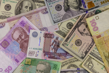 Multicurrency background of the us dollars, russian rubles and ukrainian hryvnias