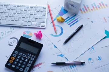 Obraz premium Data analyzing in trading market with pen. Working set for analyzing financial statistics and analyzing a market data.
