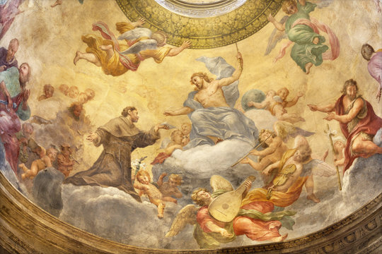 PARMA, ITALY - APRIL 15, 2018: The fresco of Jesus with the St. Francis of Assisi in side cupola of church  Chiesa di Santa Cristina by Filippo Maria Galletti (1636-1714).