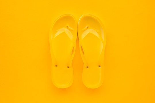 Top View Of Yellow Flip Flops Pair