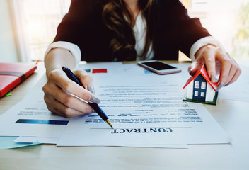 estate agent gives pen and documents agreement with customer to sign contract. Concept agreement