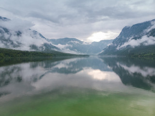 Fototapeta premium Cloudscape over Bohinj Lake in Slovenia, aerial drone view