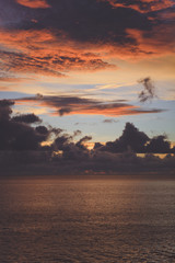 Stunning tropical sunset. Lots of clouds in the sky.