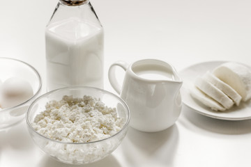 dairy products for proteic meal on white table background