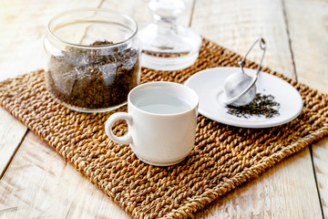 Tea set on the wooden table at sunny morning