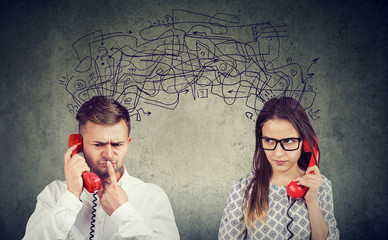 confused couple woman and man talking on the phone exchanging with many negative thoughts