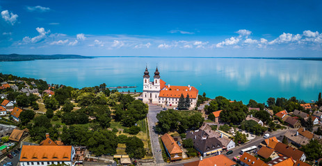 Tihany, Hungary - Aerial panoramic view of the famous Benedictine Monastery of Tihany (Tihany Abbey) with beautiful coloruful Lake Balaton at background - obrazy, fototapety, plakaty