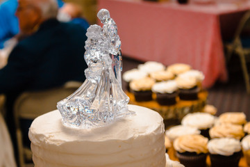Glass wedding cake topper of a dancing couple