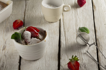 Cottage cheese casserole in white dish decorated with strawberries