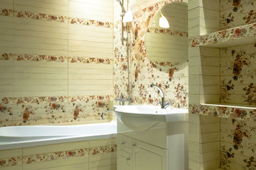 Wall decoration with ceramic tiles in the bathroom
