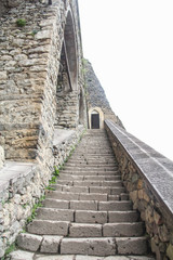 Fototapeta na wymiar Old stone staircase. Ancient temple interior. 