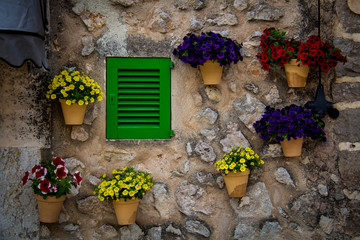 Mallorca, Spain; March 18, 2018: Color of window and flowers of the Town of Valldemossa