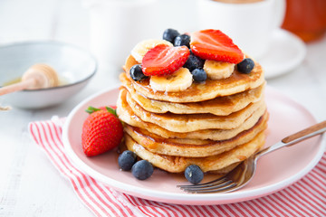 Homemade pancakes with berries and banana - Powered by Adobe