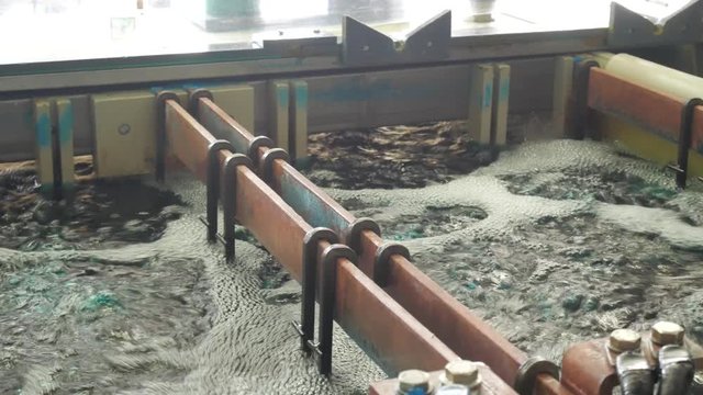 Galvanic bath, Engineering production. Circuit board in galvanic bath in the workflow