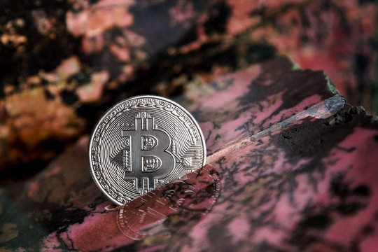 Silver bitcoin in the stone