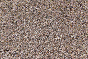 Concrete wall with small beige pebbles