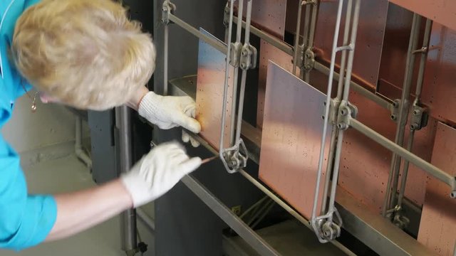 Circuit board manufacturing. Galvanic bath, Engineering production. Circuit board in galvanic bath in the workflow.