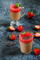 Chocolate panna cotta with strawberry isolated on black